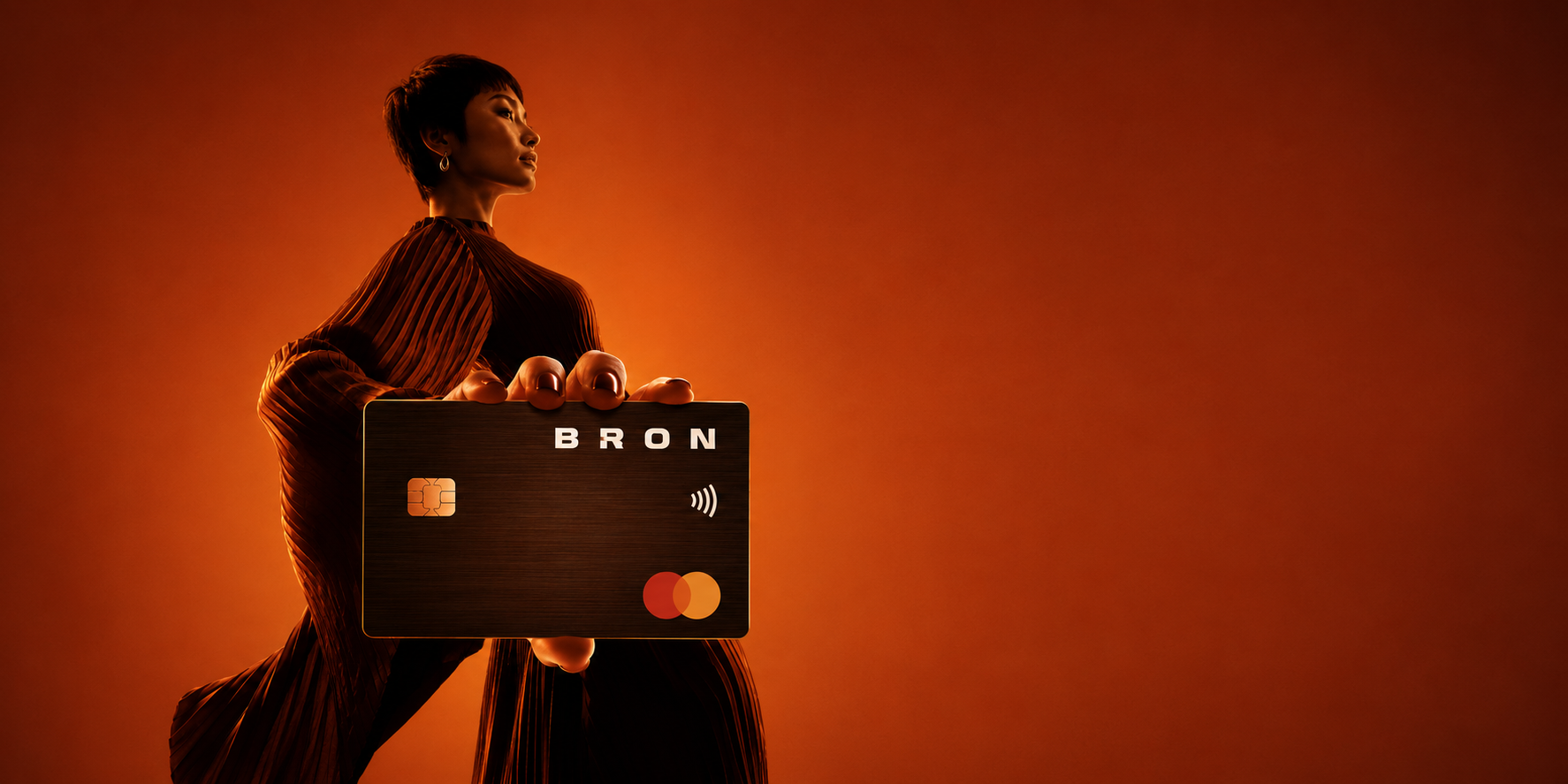 A person holding a Bron payment card
